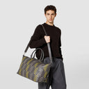 The sleek and spacious travel bag in black Mosaico nappa leather