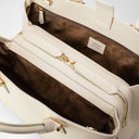 Curved Luna handbag in precious and soft Rugiada leather