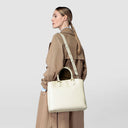 Curved Luna handbag in precious and soft Rugiada leather