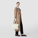 Curved Luna handbag in precious and soft Rugiada leather